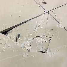 Example of cracked tiles due to inadequate surface preparation