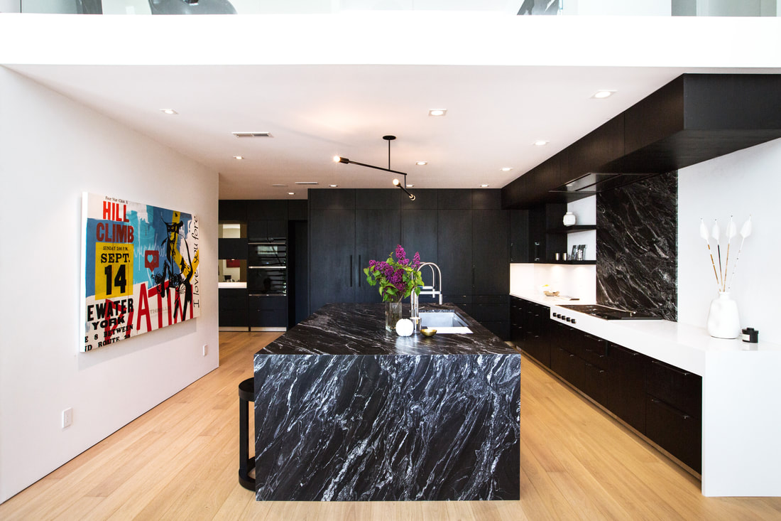 Contemporary living space with large format tiles creating seamless, uninterrupted surfaces that emphasize clean lines and modern Portland home design aesthetics